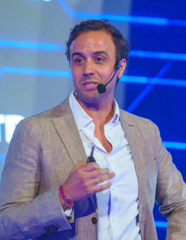 Nabil Malouli speaking on stage